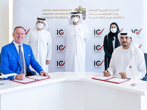 Dr. Sultan bin Ahmed Al Jaber, Minister of Industry and Advanced Technology, Sarah bint Yousef Al Amiri, Minister of State for Advanced Technology, and Mohammed Ali Al Shurafa, Chairman of Board of Directors of Etihad Aviation Group, look on as Omar Suwaina Al Suwaidi, Undersecretary of the Ministry, and Tony Douglas, Group CEO of Etihad Aviation Group, sign the MoU.