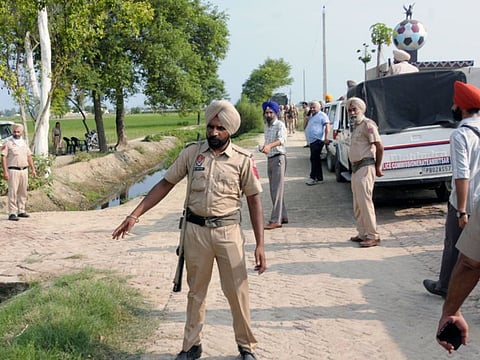 Punjab Police personnel at the site where two suspected killers of singer Sidhu Moosewala were killed in an encounter at Cheecha Bhakna village of Amritsar, on Wednesdaym July 20, 2022.