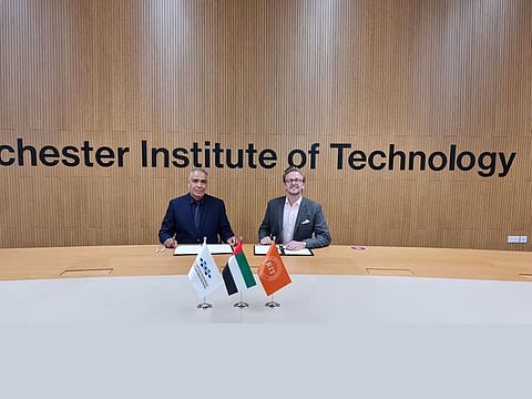 RIT Dubai President, Dr. Yousef Al-Assaf with One Moto Founder and CEO, Adam Ridgway