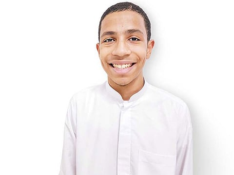 All smiles: The 14 year old after his tooth was reimplanted.