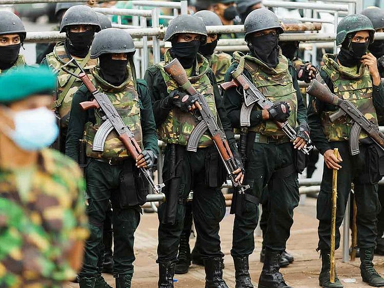 Security personnel stand guard near the Presidential Secretariat 