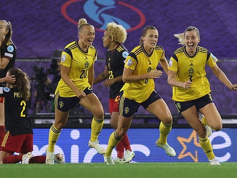 Sweden's Linda Sembrant (centre) celebrates scoring their first goal against Belgium with Magdalena Eriksson (left) and Hanna Bennison during the Women's Euro 2022 quarter final at Leigh Sports Village, Leigh, Britain.