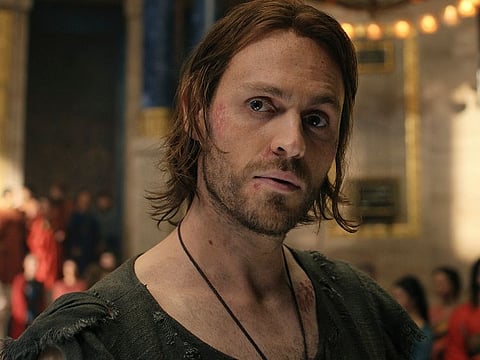 This image released by Amazon Prime Video shows Charlie Vickers as Halbrand in a scene from "The Lord of the Rings: The Rings of Power."