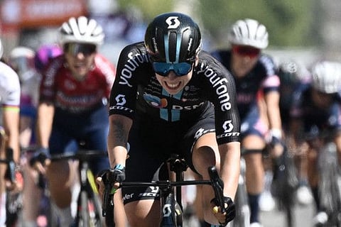 Team DSM's Dutch rider Lorena Wiebes reacts as she crosses the finish line at the end of the 1st stage of the new edition of the Women's Tour de France cycling race, 81,6 km between the Tour Eiffel and the Champs-Elysees, in Paris.