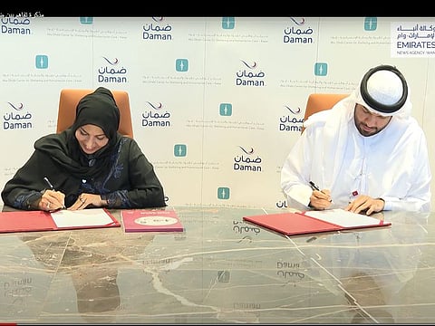 Screengrab from WAM video showing Sarah Shuhail (L), director-general of Ewaa, and Daman CEO Hamad Al Mehyas (R) signing the MoU