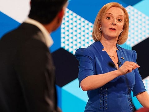 Britain's Foreign Secretary Liz Truss (R) and former chancellor to the exchequer Rishi Sunak, contenders to become the country's next prime minister.