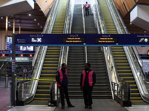 Staff members work at the London Bridge station, during a rail strike in London, Britain July 27, 2022.