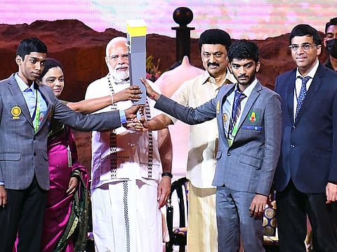Five-time world chess champion Viswanathan Anand hands over the Olympiad torch to Prime Minister Narendra Modi and Tamil Nadu Chief Minister MK Stalin at the opening ceremony of the 44th Chess Olympiad, in Chennai on Thursday.