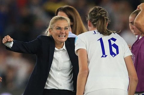 England's coach Sarina Wiegman celebrates with England's midfielder Jill Scott after winning at the end of the UEFA Women's Euro 2022 semi-final football against Sweden at the Bramall Lane stadium, in Sheffield. England won 4-0 and face Germany in the final tomorrow at Wembley.