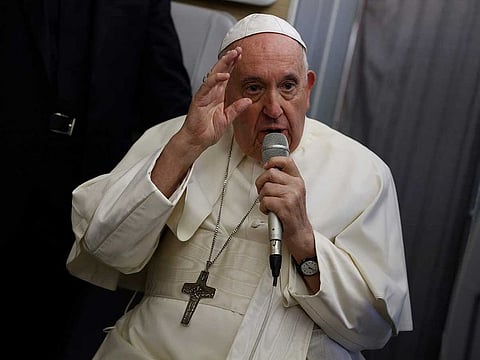 Pope Francis speaks to journalists aboard the papal flight back from Canada Saturday, July 30, 2022, where he paid a six-day pastoral visit. 