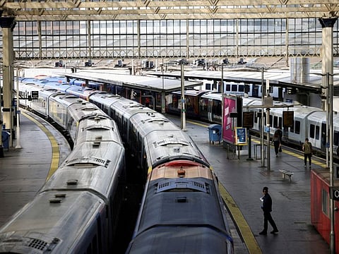 A view of trains on the platform at Waterloo Station as a station worker stands nearby, on the first day of national rail strike in London, Britain, June 21, 2022.