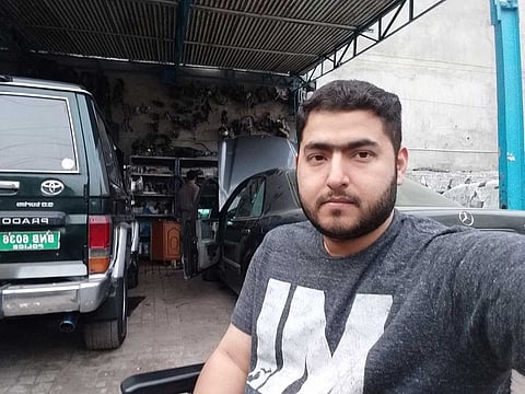 Ahmed at a workshop for his car maintenance.