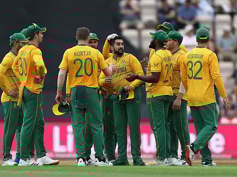 South Africa's Tabraiz Shamsi (centre) celebrates with teammates after taking the wicket of England's Adil Rashid at The Ageas Bowl, Southampton, Britain.