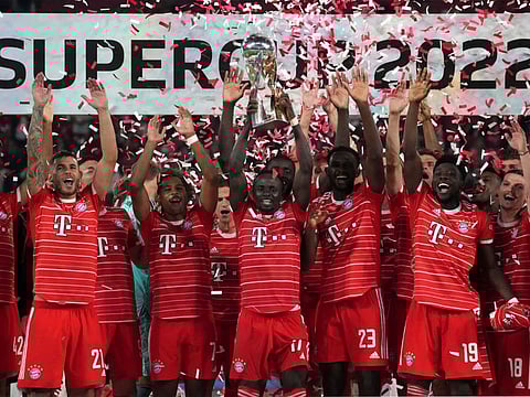 Bayern's Sadio Mane (front centre) lifts the trophy as he and his teammates celebrate winning the German Supercup 2022 after beating RB Leipzig in Leipzig, Germany.