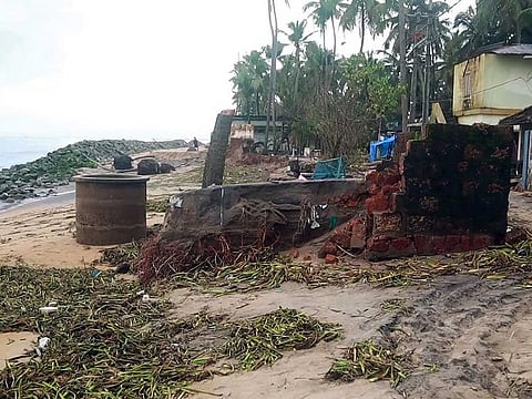  A house is damaged due to the high tides that wrecked havoc following incessant rainfall, at the Ponnani coast, in the Malappuram district.