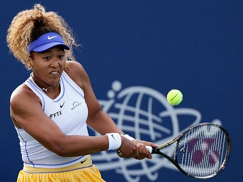 Naomi Osaka, of Japan, returns to Zheng Qinwen, of China, during the Mubadala Silicon Valley Classic tennis tournament in San Jose, Calif.