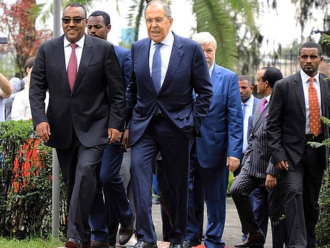 Russian Foreign Minister Sergey Lavrov, centre, walks with Ethiopian Deputy Prime Minister Demeke Mekonnen, left, as they visit the compound of the Russian Embassy in Addis Ababa, Ethiopia, in this image from July 27, 2022