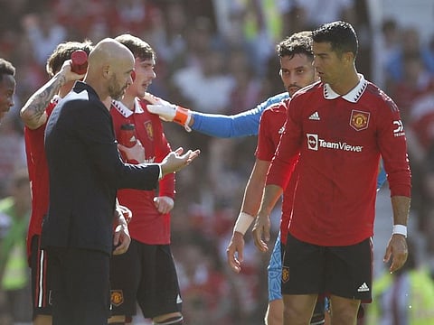 Manchester United manager Erik ten Hag speaks with Cristiano Ronaldo during the pre-season friendly against Rayo Vallecano at Old Trafford on Sunday.