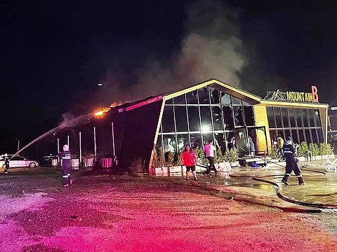 Firefighters working to contain a fire at the Mountain B nightclub in Sattahip district in Thailand's Chonburi province. 