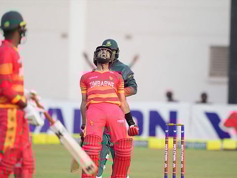 Zimbabwe's batsman Sikandar Raza celebrates after guiding Zimbabwe to victory in the first One Day International against Bangladesh at Harare Sports Club on Friday.