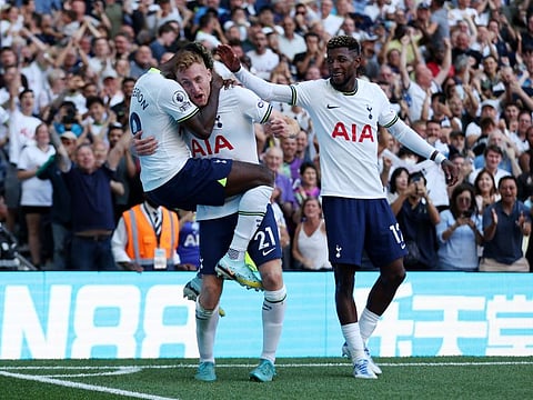 Tottenham Hotspur's Dejan Kulusevski (centre) celebrates scoring their fourth goal with Ryan Sessegnon and Emerson Royal.