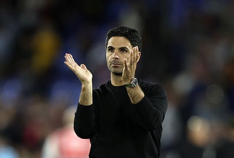 Arsenal's manager Mikel Arteta applauds supporters at the end of the English Premier League match against Crystal Palace at Selhurst Park stadium in London.