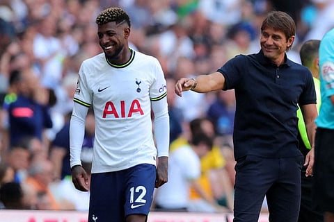 Tottenham Hotspur's Italian head coach Antonio Conte (right) shares a lighter moment with Brazilian defender Emerson Royal during the English Premier League football match against Southampton at Tottenham Hotspur Stadium in London. Spurs won 4-1.
