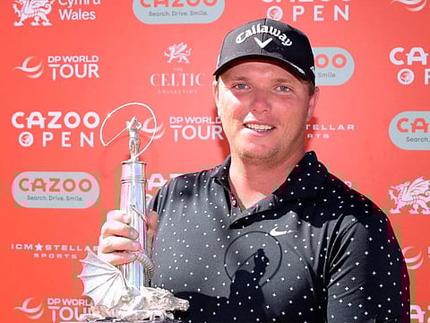 Champion Callum Shinkwin with the Cazoo Open supported by Gareth Bale trophy.