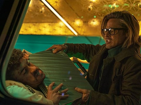  This image released by Sony Pictures shows Bad Bunny, left, and Brad Pitt in a scene from "Bullet Train."