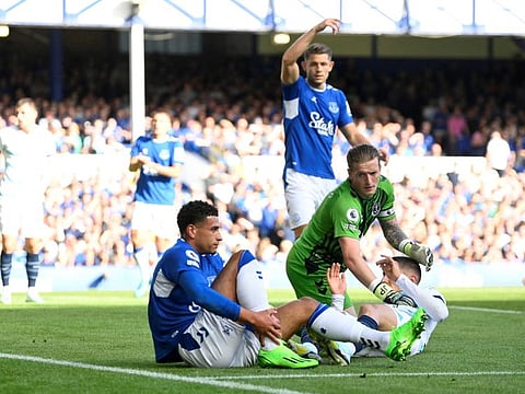 Everton's Ben Godfrey (left) will be out of action for at least 3 months after fracturing his leg against Chelsea last weekend during the Premier League clash at Goodison Park.