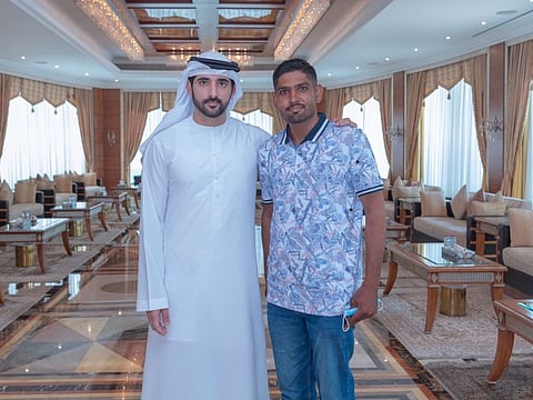  Sheikh Hamdan bin Mohammed bin Rashid Al Maktoum with delivery man Abdul Ghafoor.