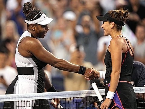 Serena Williams left shakes hands with Belinda Bencic after losing her final match in Toronto on Wednesday.