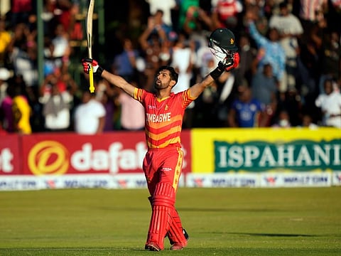 Zimbabwean batsman Sikandar Raza celebrates after scoring century in the One Day International against Bangladesh in Harare last Sunday.