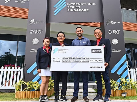 Cho Min Thant, Asian Tour's CEO and Commissioner hands over the cheque to the Singapore Golf Association's Junior Development Programme on the sidelines of this week's Asian Tour event in Singapore.