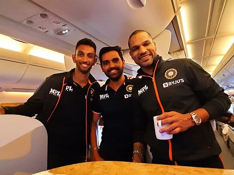 Confidence sky-high... Shikhar Dhawan (right), Deepak Chahar (centre) on board a flight to Zimbabwe.