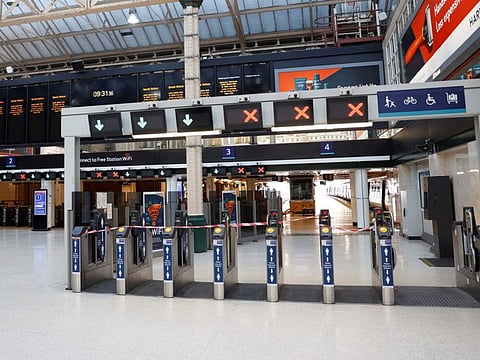 A photograph taken on August 3, 2022 shows closed trains ticket barriers at Charing Cross train station in London, as a fresh railway strikes hit the country. A strike by train drivers caused major disruptions in rail transport on August 13, 2022 in the United Kingdom, where social movements are multiplying under the effect of soaring prices.
