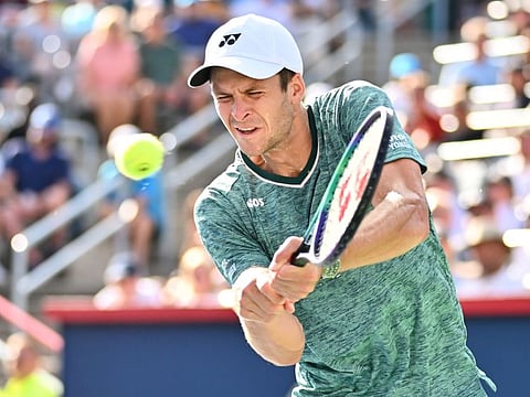 Hubert Hurkacz of Poland hits a return against Casper Ruud of Norway in the semifinals during Day 8 of the National Bank Open at Stade IGA in Montreal, Canada.