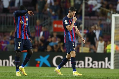 Firing blanks... Barcelona's Ousmane Dembele (left) and Robert Lewandowski walk off the pitch at the end of a Spanish La Liga match agaimst Rayo Vallecano at the Camp Nou stadium in Barcelona, Spain.