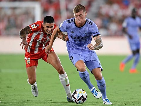 Real Madrid's Toni Kroos (right) is chased by Almeria's Chumi during the Spanish La Liga match at the Power Horse stadium in Almeria, Spain.