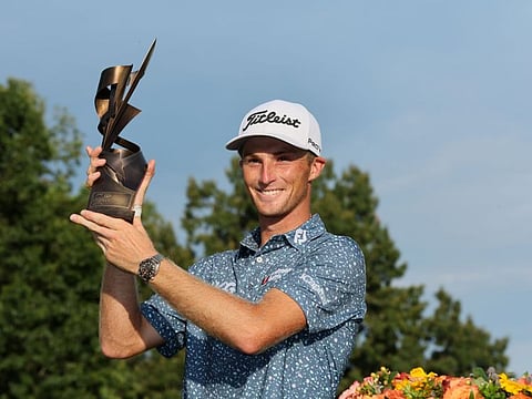 Will Zalatoris of the United States with the trophy after putting in to win on the third play-off hole on the 11th green in the final round of the FedEx St. Jude Championship in Memphis on Sunday.