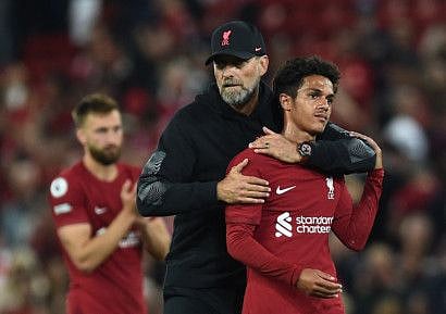 Liverpool manager Juergen Klopp hugs striker Fabio Carvalho after the match against Crystal Palace at Anfield.