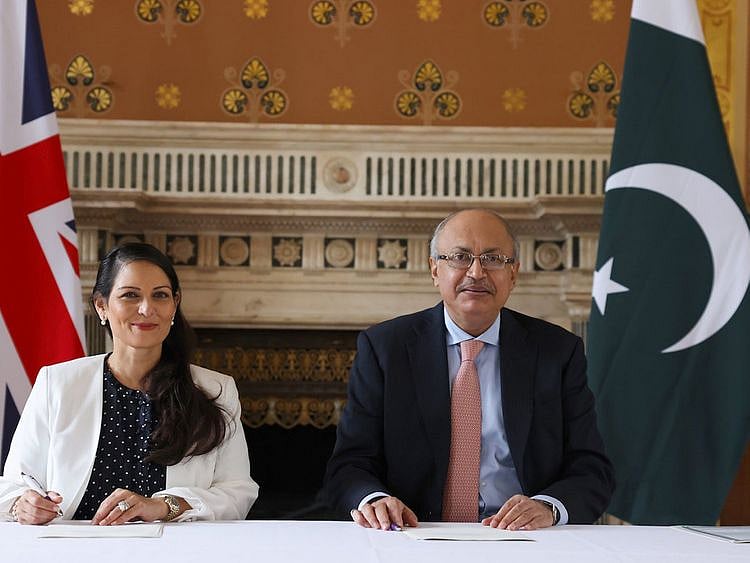 UK Home Secretary Priti Patel and Pakistan Interior Secretary Yousaf Naseem Khokhar sign the agreement on foreign criminals and immigration offenders at Pakistan High Commission in London on August 17, 2022. 