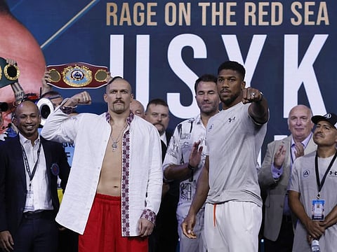 Oleksandr Usyk (left) and Anthony Joshua pose during the weigh-in ahead of their WBA, WBO and IBF Heavyweight World Title fight at the Shangri-La Ballroom, Jeddah, Saudi Arabia.