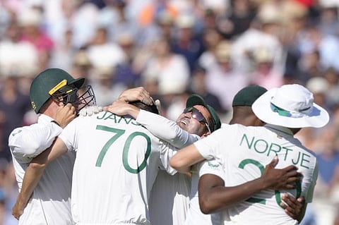 South Africa's captain Dean Elgar celebrates with his players as they win the first Test match against England by an innings and 12 runs on the third day at Lord's cricket ground in London.