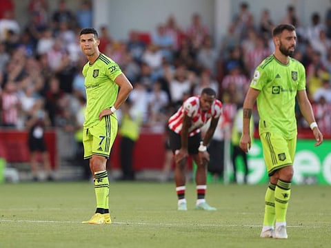 Manchester United's Cristiano Ronaldo (left) looks round after the end of the English Premier League match against Brentford at the Gtech Community Stadium in London. Manchester United lost 4-0.