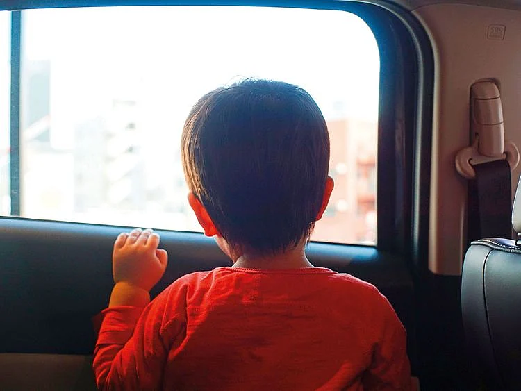 Child inside a car, child in car, child in a car