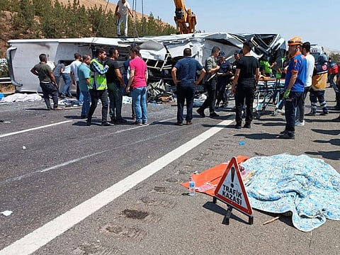 Rescue and emergency responders work at the scene after a bus crash on the highway between Gaziantep and Nizip, Turkey.