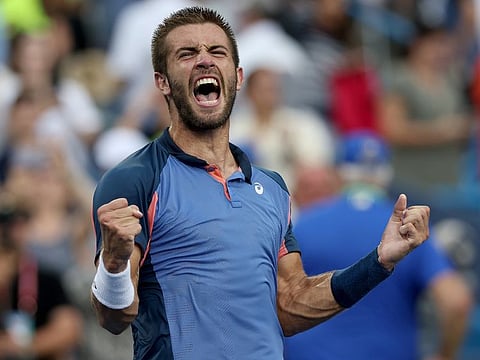 Borna Coric of Croatia celebrates his win over Stefanos Tsitsipas of Greece during the men's final of the Western & Southern Open at Lindner Family Tennis Center in Mason, Ohio.