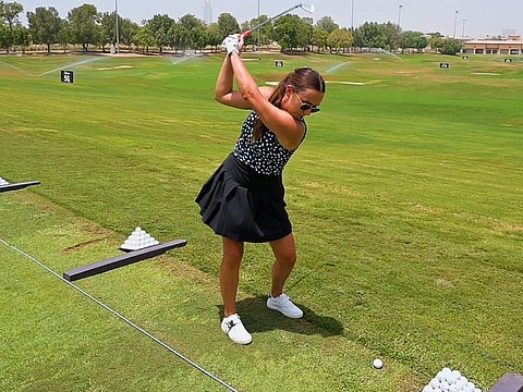 Play time! Hannah Mannion tees off at Jumeirah Golf Estates. She manages to find the time in spite of her busy working schedule. 