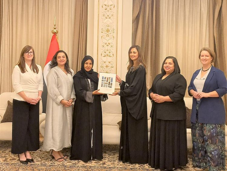 Her Excellency Dr Maitha Al Shamsi Receiving the book from Rima Al Mokarrab-1661342572878